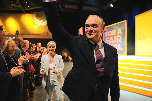 Ed Davey waves to the crowd after his conference speech